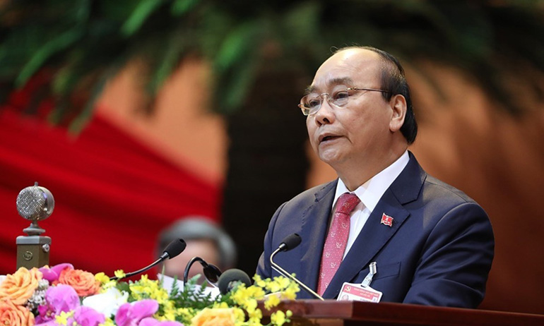 Ủy viên Bộ Chính trị, Thủ tướng Chính phủ Nguyễn Xuân Phúc thay mặt Đoàn Chủ tịch đọc diễn văn khai mạc đại hội - Ảnh: TTXVN
